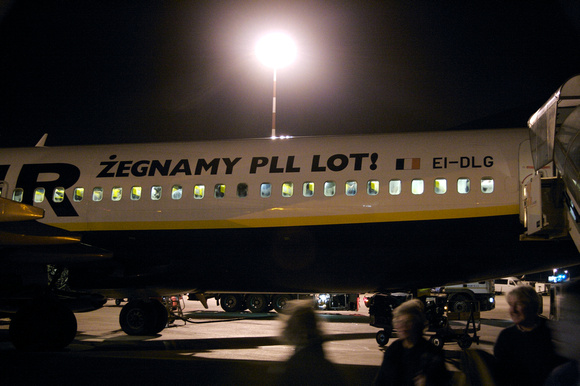 "Bye Bye, LOT" refering to the Polish flag carrier.