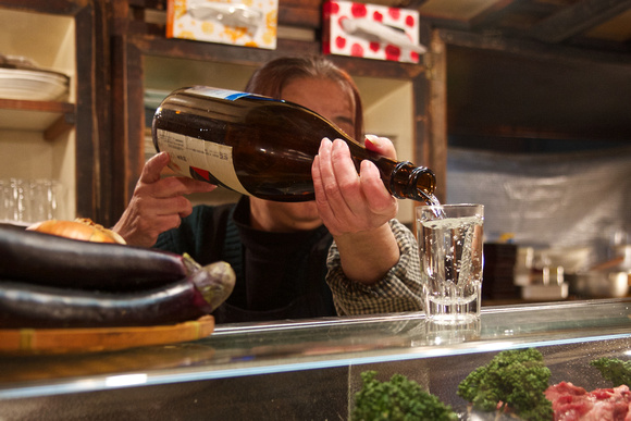Seishu sake is poured from 1.8L bottles.