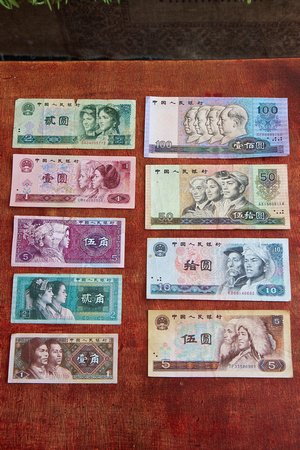 For some reason, she decides to show us her collection of the previous (4th) series of banknotes.