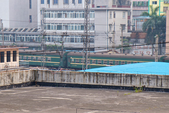 View from our room - Green-skinned local trains with no A/C still exist.