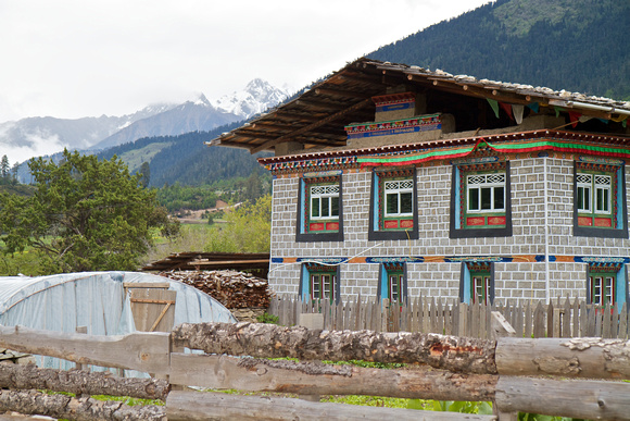 Houses in this village still have traditional wooden roofs held down by stones.