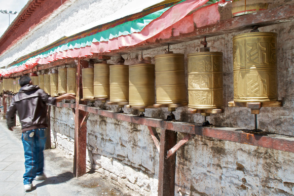 Prayer wheels at the side entrance of Potala Palace.