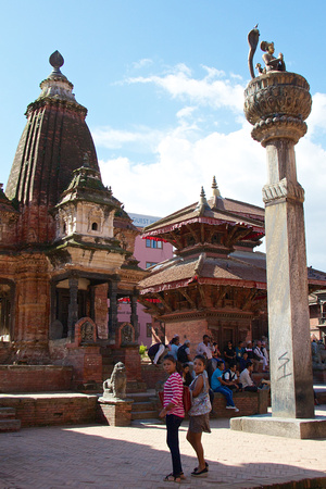 Cobra on pillar is Yoganarendra Malla, facing the Degu Talle temple of the Royal Palace.