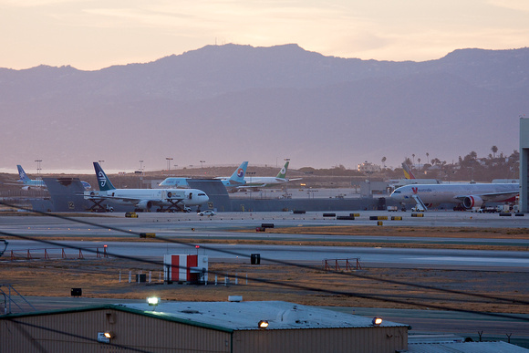 A nice collection of Asian Pacific widebodies at the far end of LAX.   All waiting for late evening departures.
