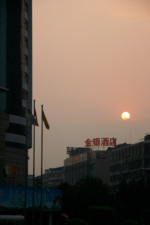 Sun setting behind the smog.