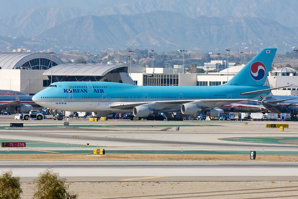 KE 744 HL7495 being towed to the far apron.   Will fly back to ICN later in the evening as KE12.