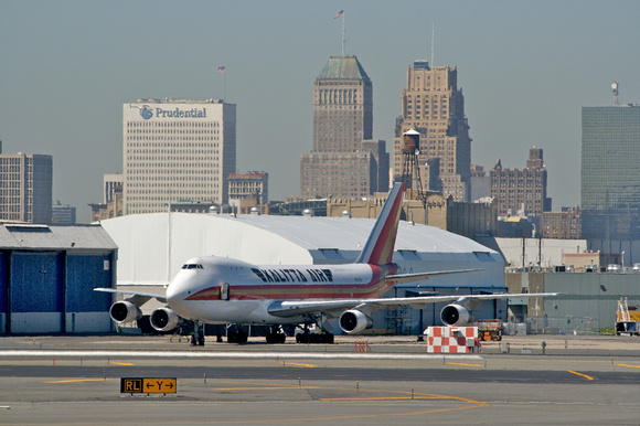 Lots of cargo planes at EWR.  A Kallita 747-100/200 with Newark in background.