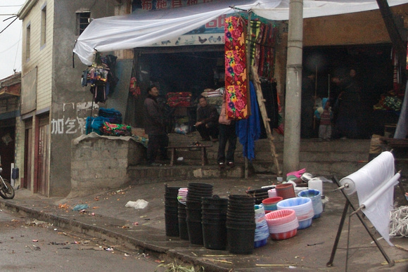 Check out those pink and blue plastic basins for sale.